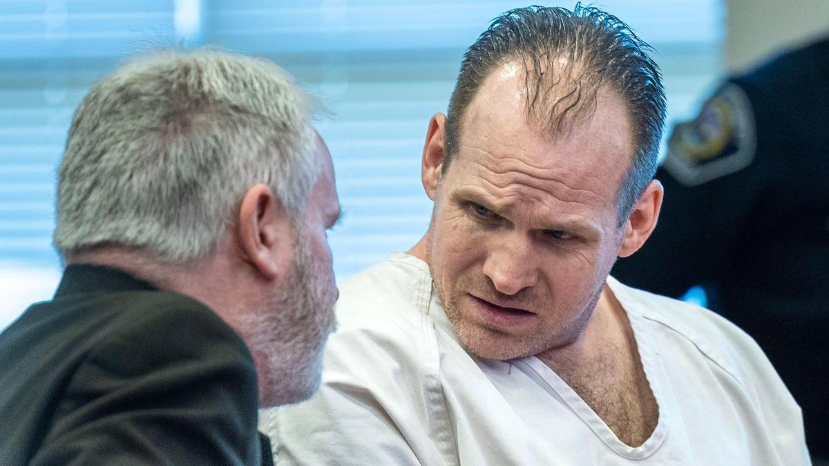 Jacob Miller speaks with his defense attorney after being sentenced to life in prison Thursday, with the possibility of parole after 22 years. He pleaded guilty to three charges after he hit two pedestrians in a crosswalk going about 45 mph. He ran a red light in downtown Boise last summer while driving drunk.