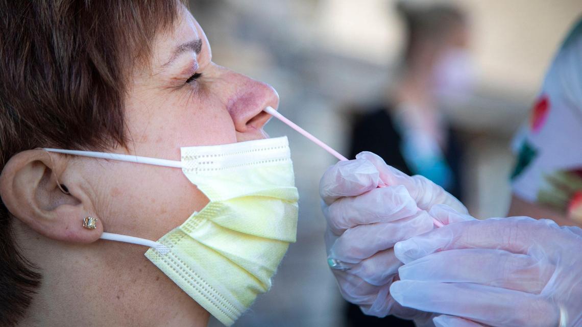 Pamela Downer, the RN oversight manager at Veranda Senior Living in Meridian, is tested via nasal swab for COVID-19 by another employee, as the staff are trained on how to administer coronavirus tests by Crush The Curve Idaho on Thursday, May 28, 2020.