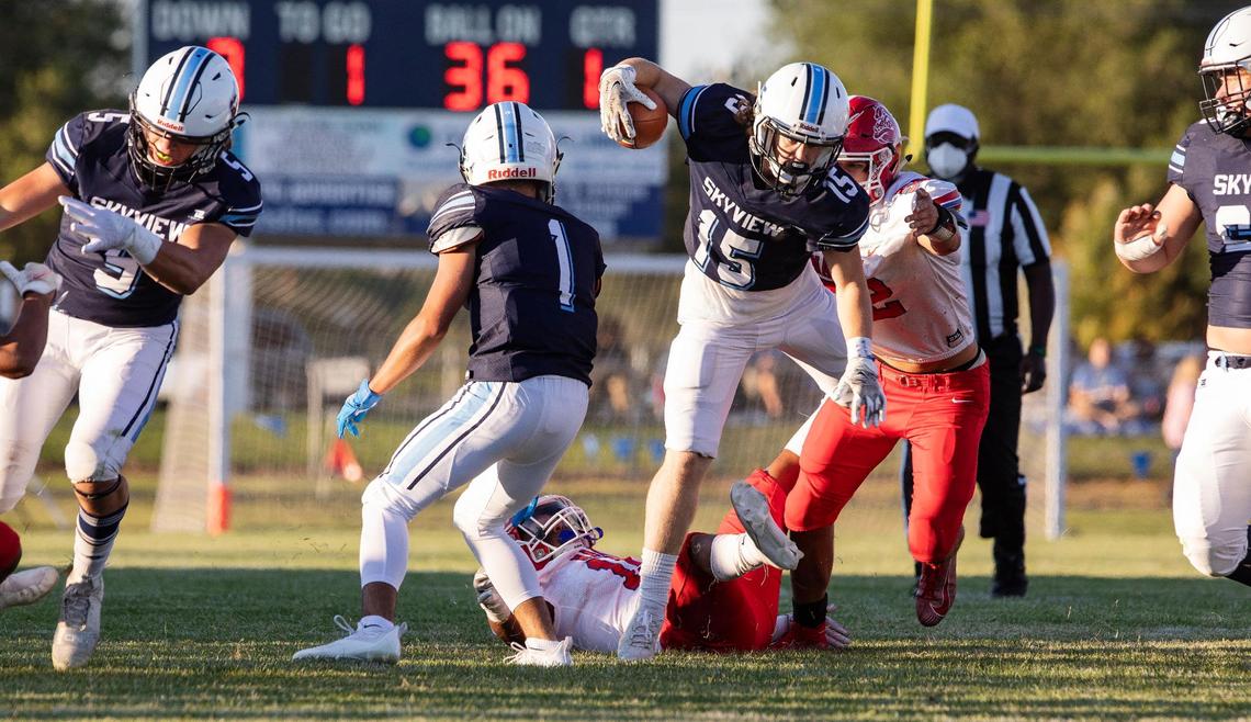 Skyview’s Andrew Schneider steps over a Nampa defender Sept. 3 at Skyview.