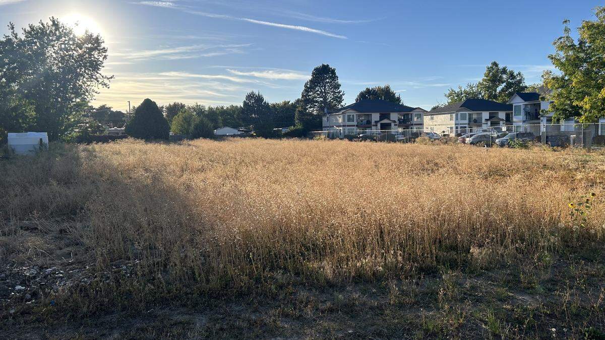 The church’s plans call for developing a vacant 2-acre parcel, pictured here, into 27 dorms with three or four bedrooms each.