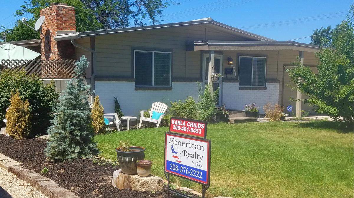 A for-sale sign stands in front of a house at 101 S. Liberty St., on the Boise Bench. The 3-bedroom, 2-bath home is priced at $234,900.