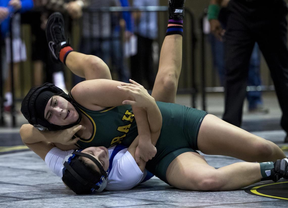 Borah’s Kaci Bice puts Vanessa Ruiz of Nysaa on her back for an eventual pin in the 126-132 pound girls division championship bracket of the Rollie Lane Invitational Friday, Jan. 4, 2019 at the Idaho Center in Nampa.