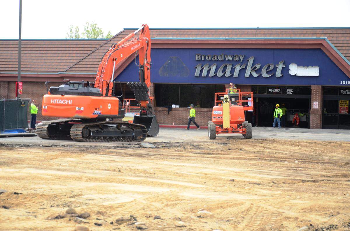 Demolition workers leave the Broadway Avenue Albertsons store before starting work to demolish the store, which opened in 1959. The Boise company is building a larger store across the parking lot that is expected to open in June.