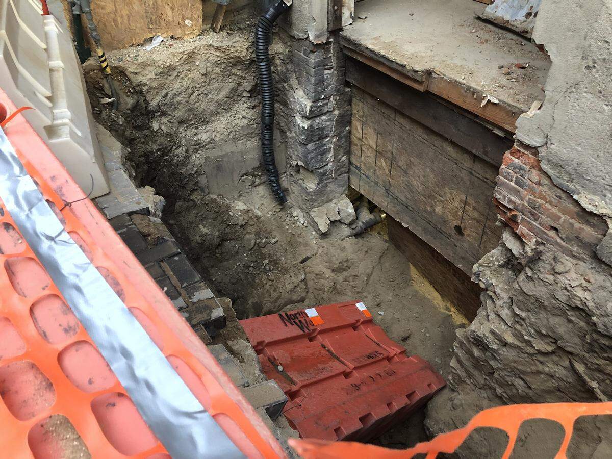 Two women were hospitalized after they plunged into this 12foot-deep construction hole during an e-scooter crash Friday night in a Downtown Boise alley. Barriers surrounded the hole but were not fastened down, according to the Boise Fire Department.