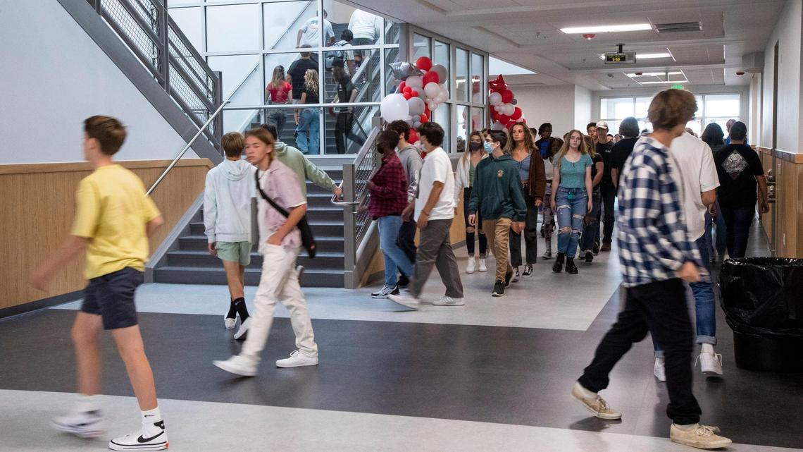 Students fill the halls of Owyhee High School on their way to class after attending a first-day school assembly outdoors on the new school’s football field. Several schools and districts across Idaho have ​closed temporarily due to the spread of COVID-19, and high numbers of students and teachers are out sick.