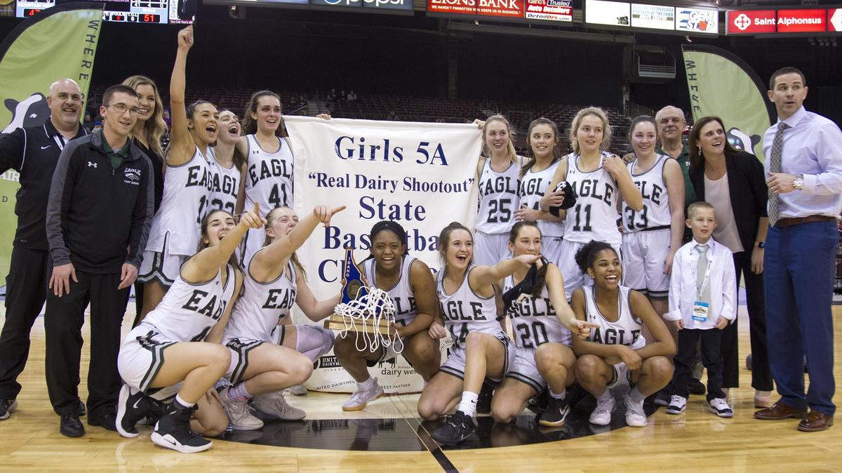Eagle poses for photos in front the state 5A girls basketball championship banner after defeating Mountain View 51-47 Saturday, Feb. 16, 2019 at Ford Idaho Center in Nampa.