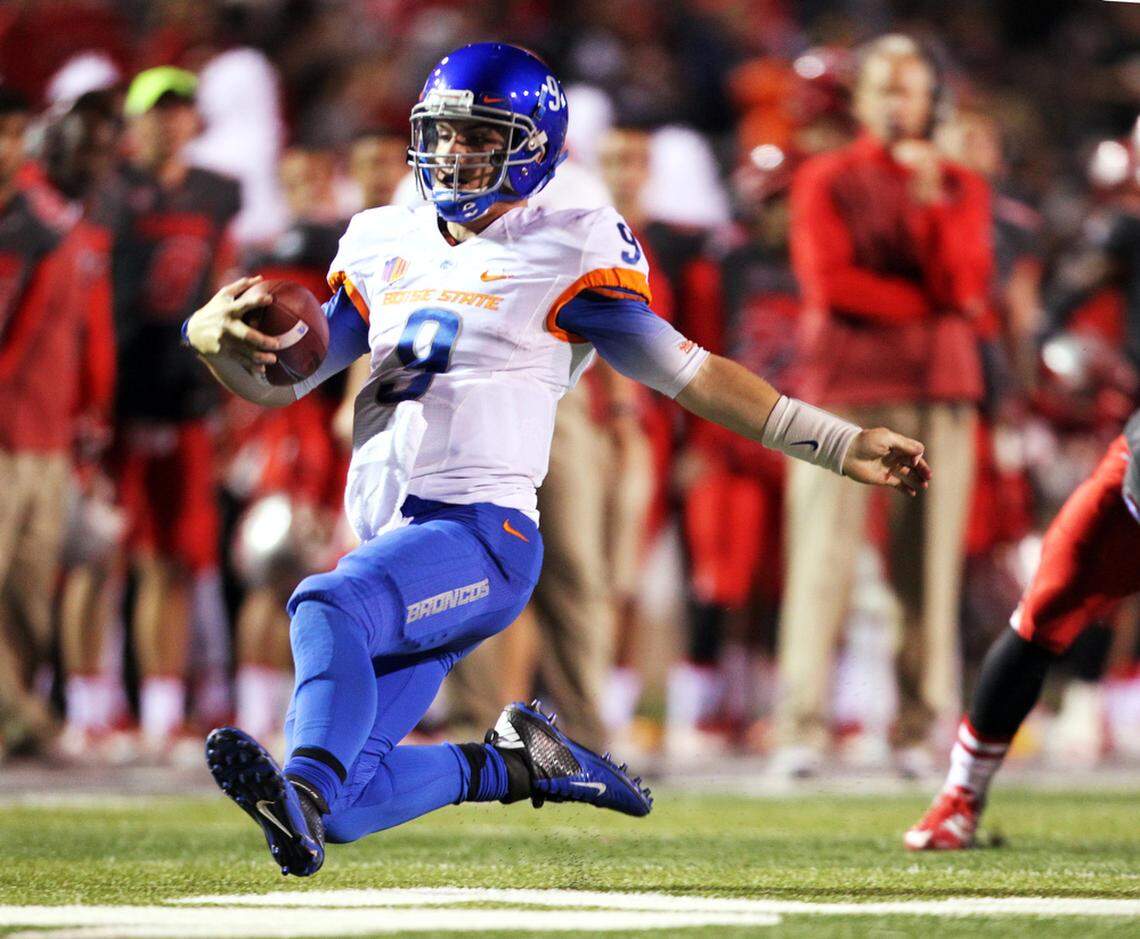 Former Boise State quarterback Grant Hedrick slides after one of his 15 rushing attempts against New Mexico at University Stadium in Albuquerque in November 2014.