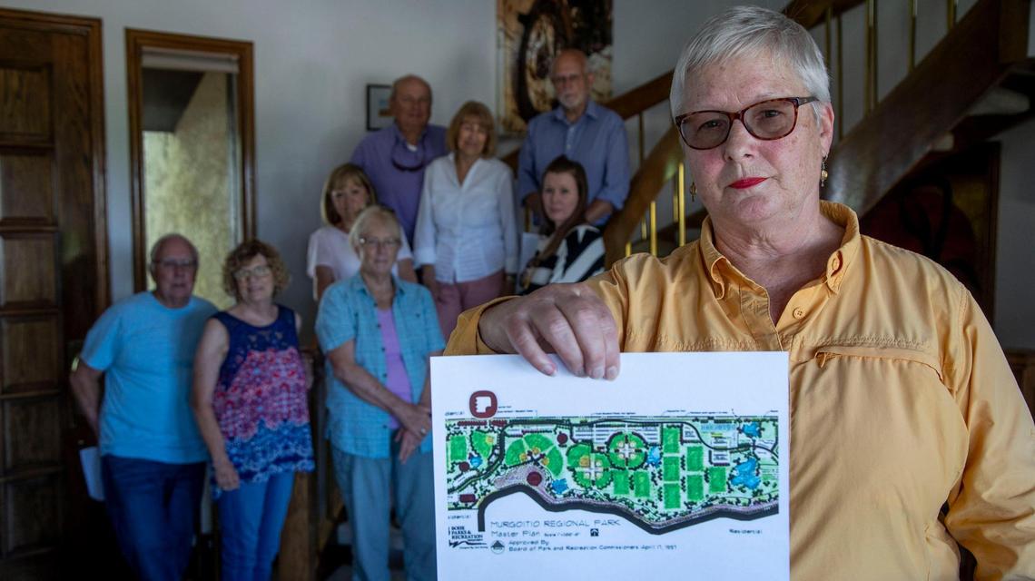 Homeowner Paula Triplett holds a plan designed the city of Boise in 1997 for Murgoitio Park, a 160-acre sports complex promised for years in South Boise. Homeowners in the area are upset after hearing of a proposed plan between Boise and a developer to swap 153 acres of the parcel for a Foothills project.