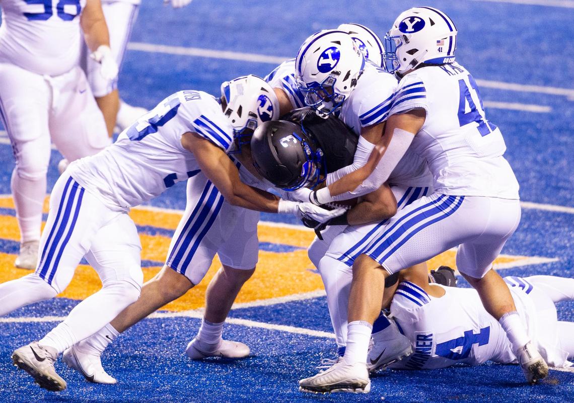 Boise State tight end Riley Smith (3) gets tackled by the BYU defense during the game against BYU at Albertsons Stadium. BYU defeated Boise State 51-17 Friday, Nov. 6, 2020.