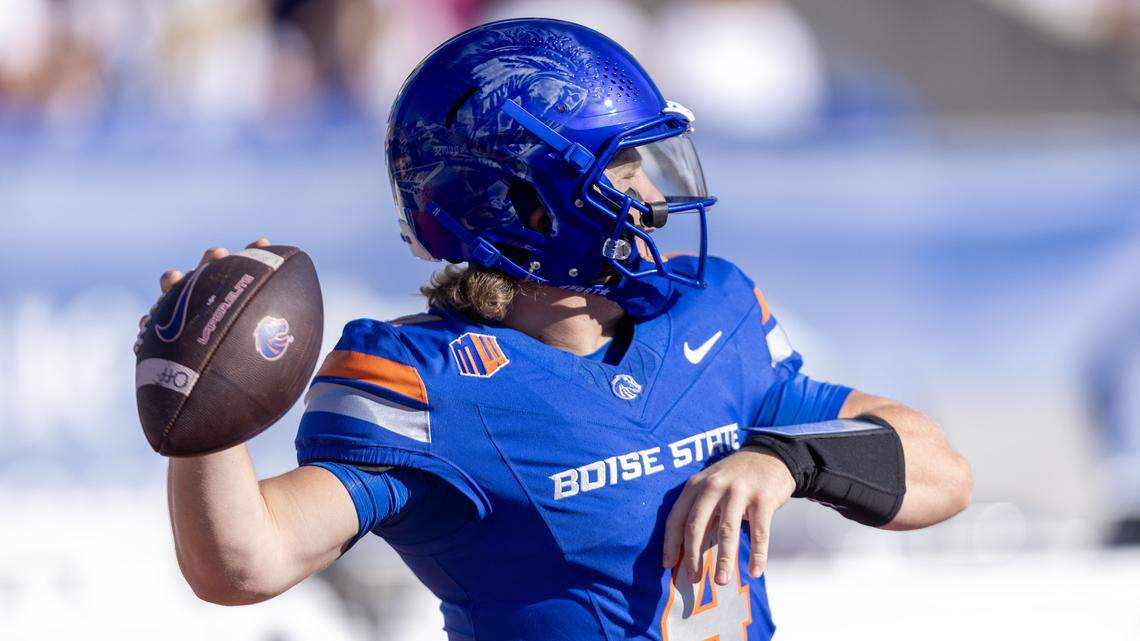 Boise State quarterback Maddux Madsen, warming up before the game, threw for four touchdowns and over 300 yards to help the Broncos rout Appalachian State.
