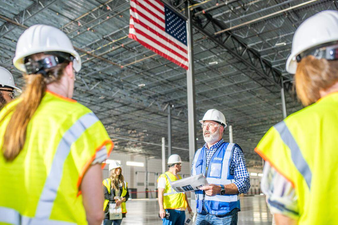 Adrian Wengert, St. Luke’s vice president of supply chain, speaks to employees at the new medical supply and distribution center.