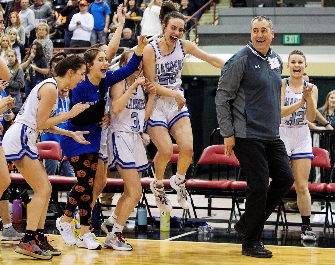 Cole Valley Christian reacts to a victory dance by coach Matt Beglinger after winning the 2A girls basketball state championship on Saturday.