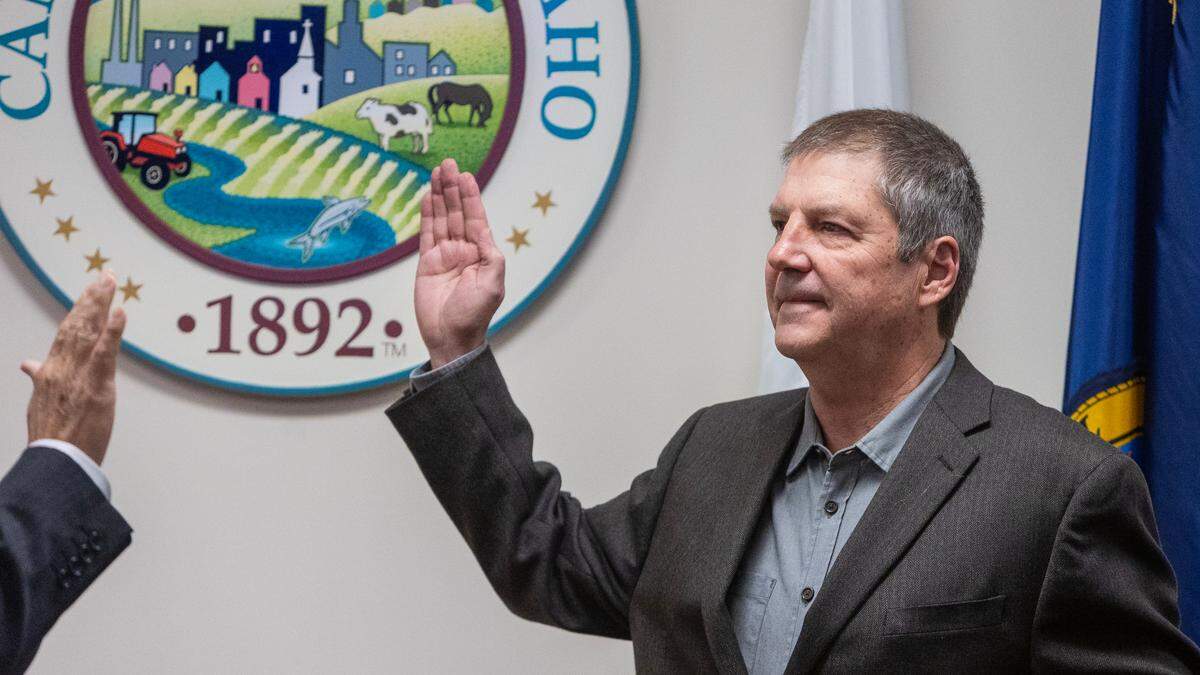 Canyon County Clerk Chris Yamamoto swears-in county commissioner Brad Holton to office on Jan. 9, 2023 at the county administration building in Caldwell.