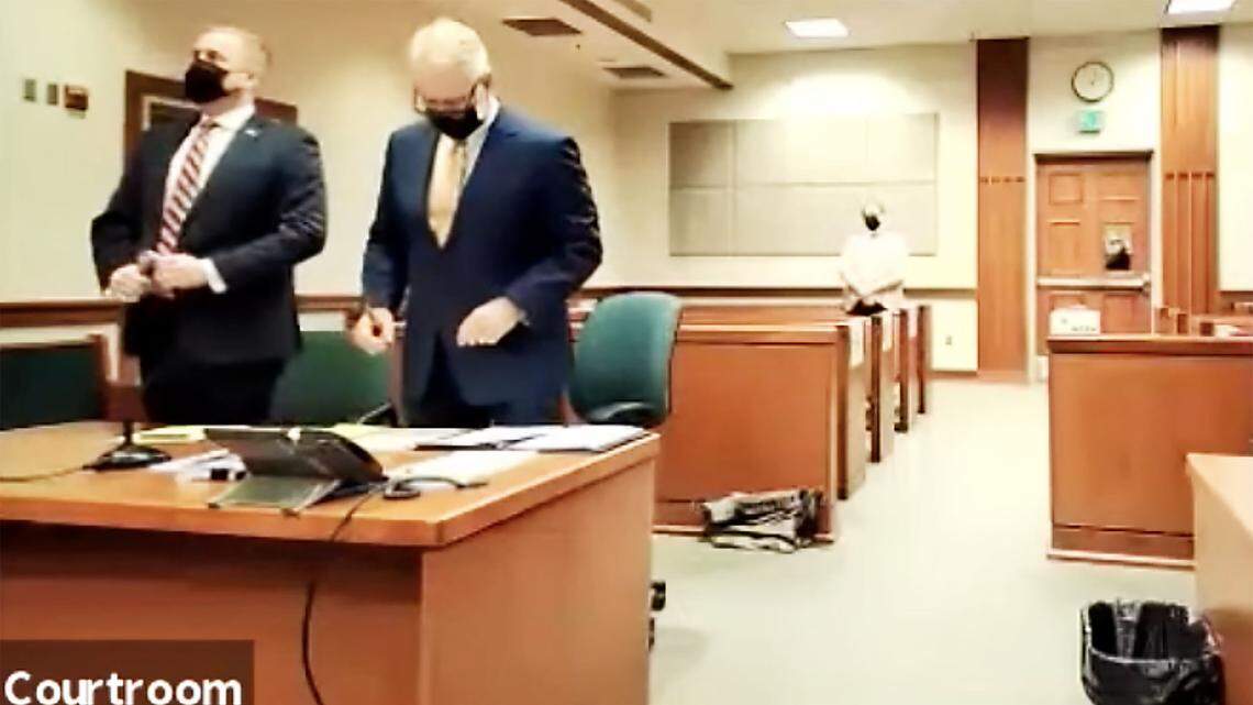 In court-provided livestream, Aaron von Ehlinger, left, stands with counsel at his preliminary hearing Friday at the Ada County Courthouse in Boise.