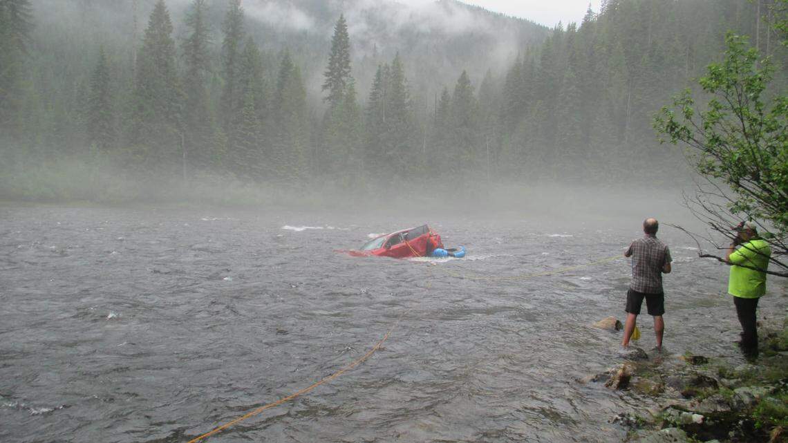 People rushed to save a 91-year-old man trapped inside a car in a river in Idaho.