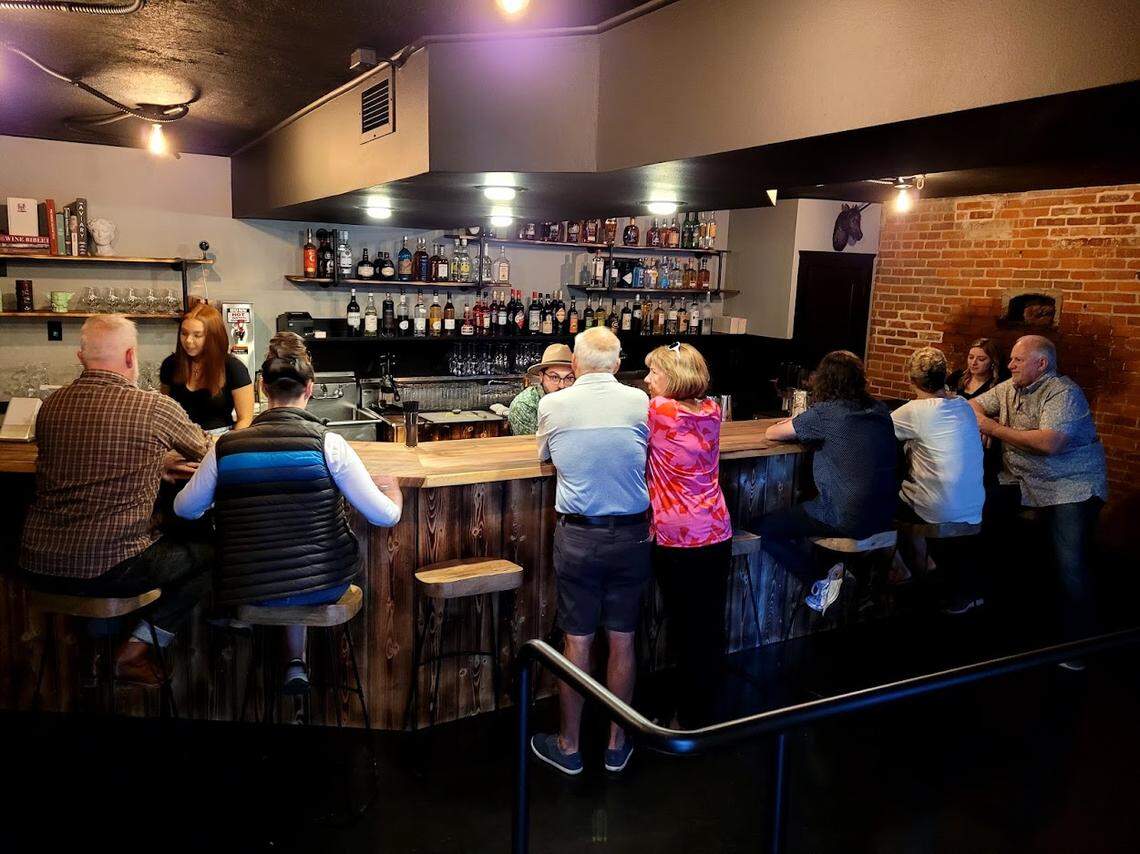 Guests enjoy drinks during a soft opening of downtown Boise’s newest bar.