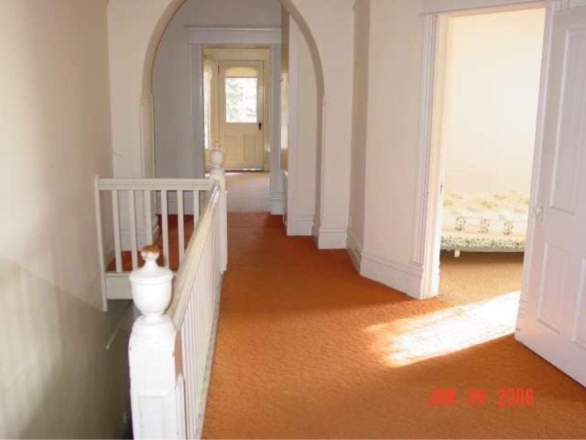 The Nathan Smith House was built at 2315 S. Broadway Ave. in 1900 by Tourtellotte and Hummel and earned a spot in the National Register of Historic Places. The home survived a fire on Nov. 28, 2023 and developers plan to build town houses around the site. This image shows the second floor landing of the home.