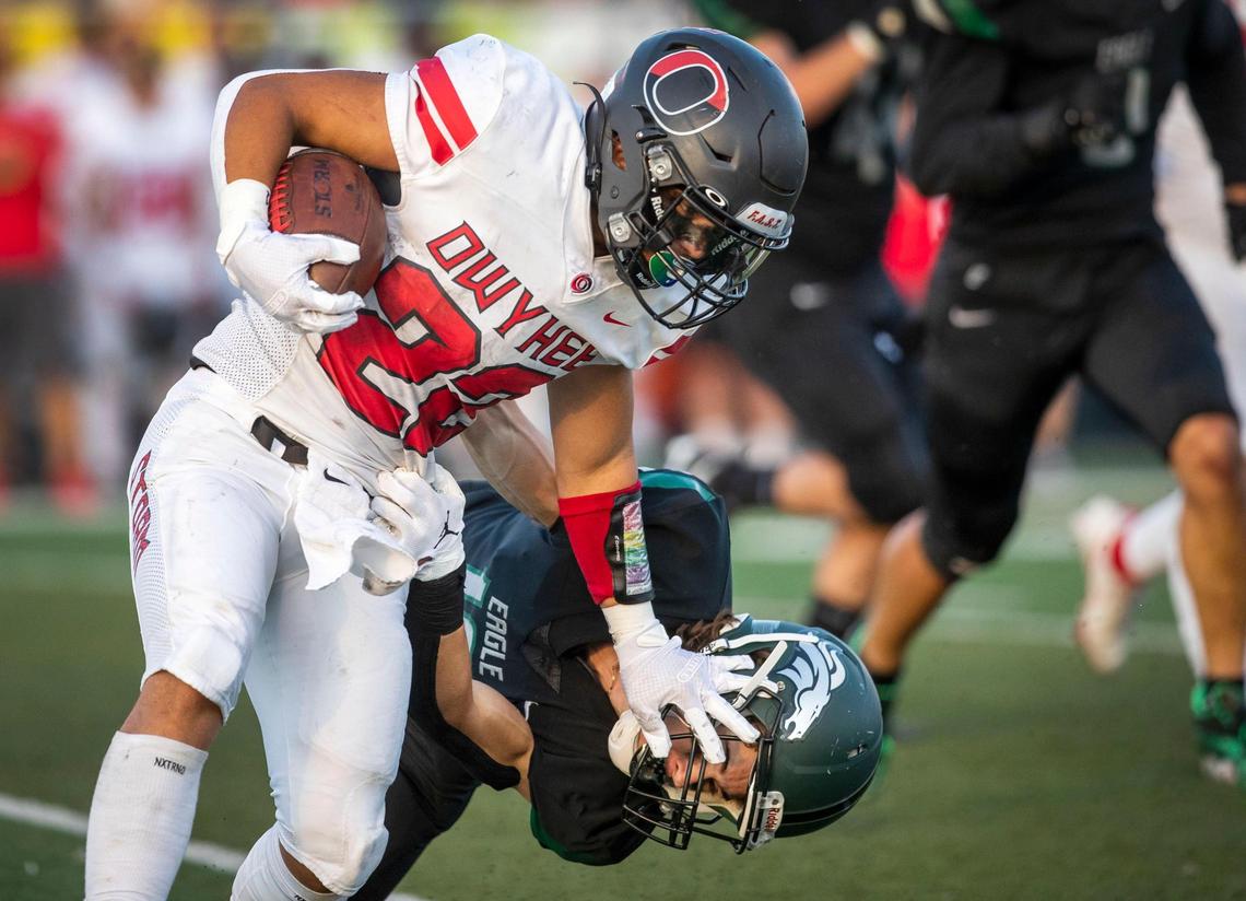 Owyhee running back Cade Walker fends off a tackle by Eagle’s Tristan Walker on Sept. 16. The Storm host Nampa on Friday in a key game in the 5A SIC River Division.