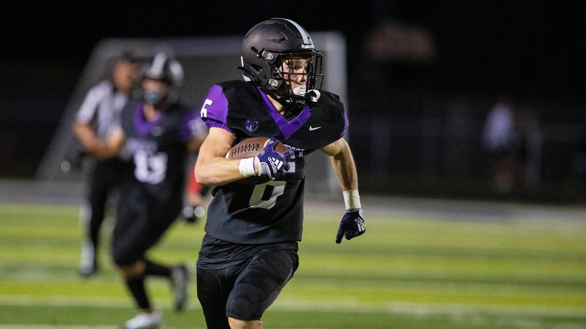 Rocky Mountain safety Troy Wilkey makes a touchdown run on a punt return in the fourth quarter of their game against Coeur d’Alene at home on Friday.