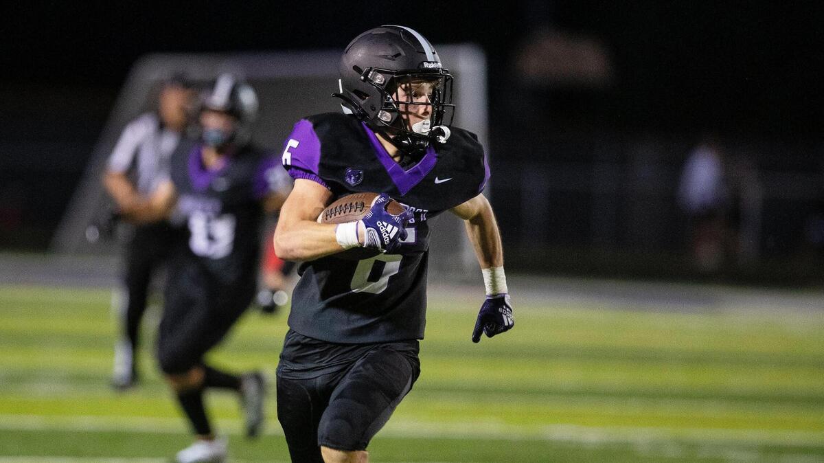 Rocky Mountain safety Troy Wilkey makes a touchdown run on a punt return in the fourth quarter of their game against Coeur d’Alene at home on Friday.
