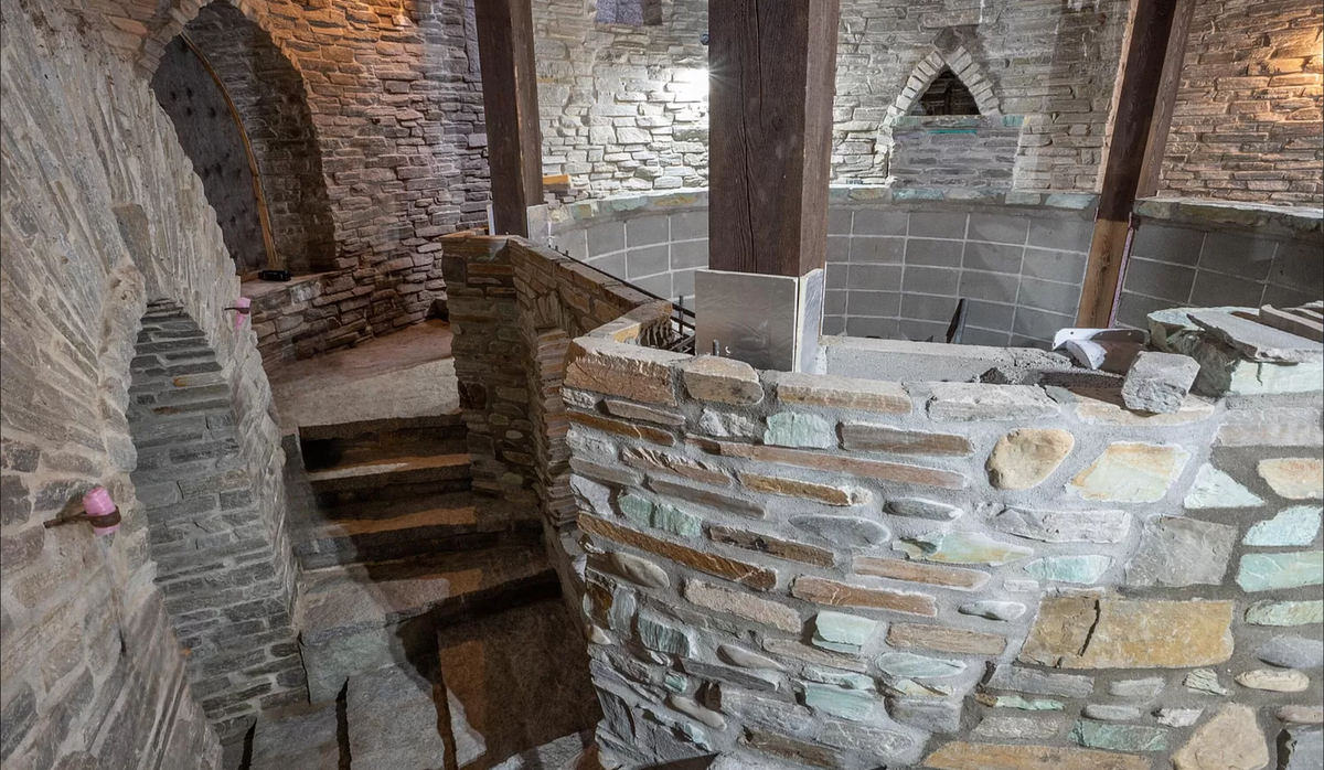A tunnel from the dock will lead you to an indoor plunge pool surrounded by granite walls.