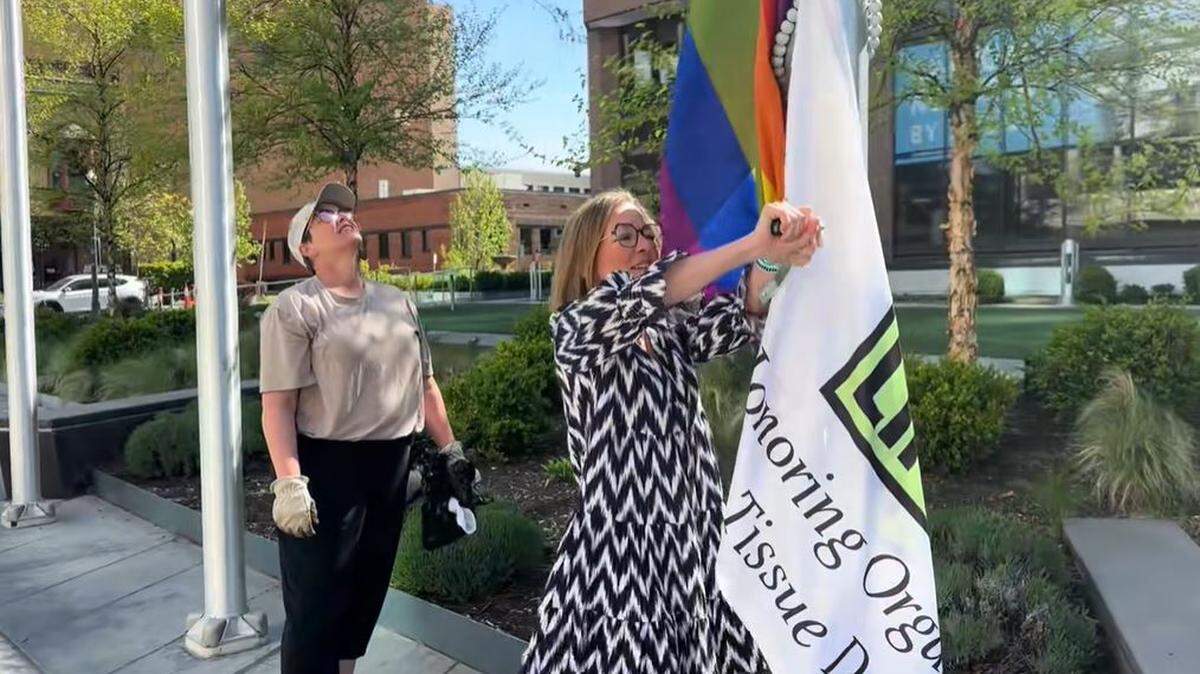 A video shared with the Idaho Statesman shows Mayor Lauren McLean putting Pride and Donate Life flags back up after activists covered them.