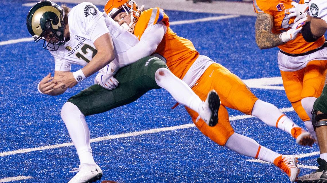 Colorado State quarterback Patrick O’Brien fumbles after being hit by Boise State defensive end Shane Irwin during a game in 2020. Irwin announced Thursday that he has medically retired.