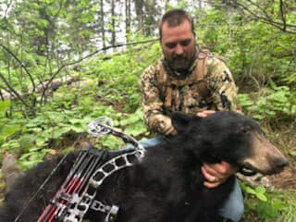 Scott Schmid, of Nampa, takes a look at the first bear he’d ever harvested in this 2017 photo. Schmid said he tries to be cautious of what he shares on social media to avoid backlash. On this occasion, Schmid’s hunting partner got a photo of “that moment of respect, remorse and reverence that is rarely captured.”