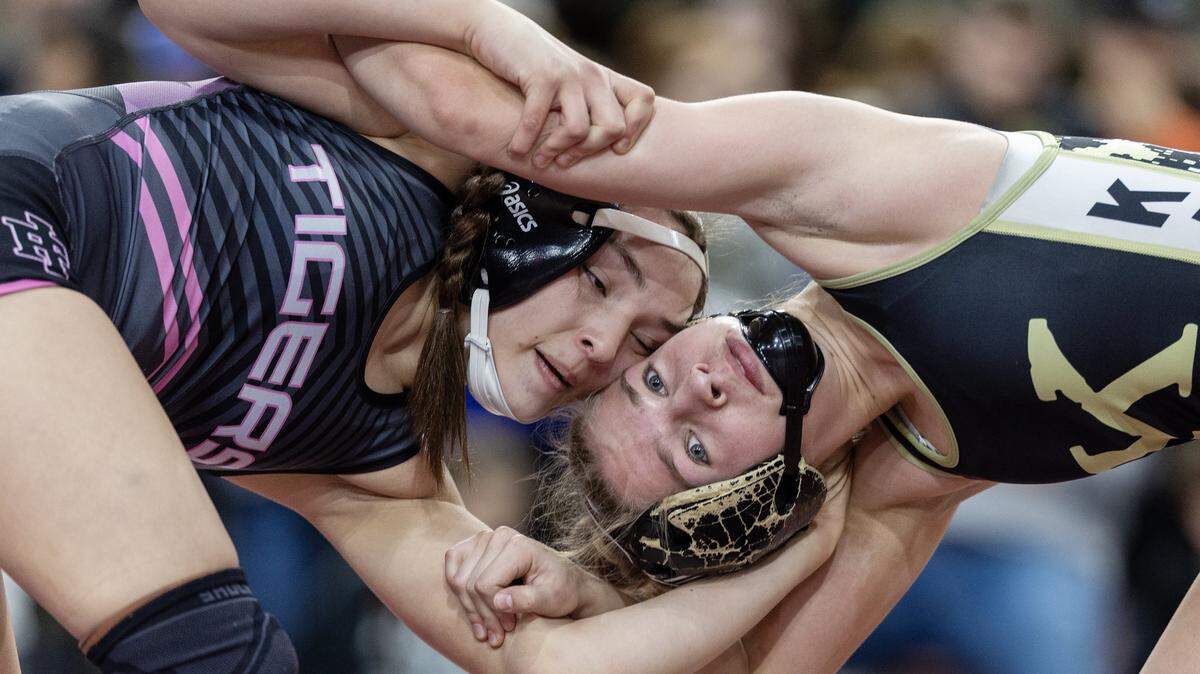 Idaho Fall's Airianna Ayala, left, and Kuna's Taylor Drake, right, wrestle at the Rollie Lane Invitational, Saturday, Jan. 3, 2026. Drake won the match 18-8 in a major decision.
