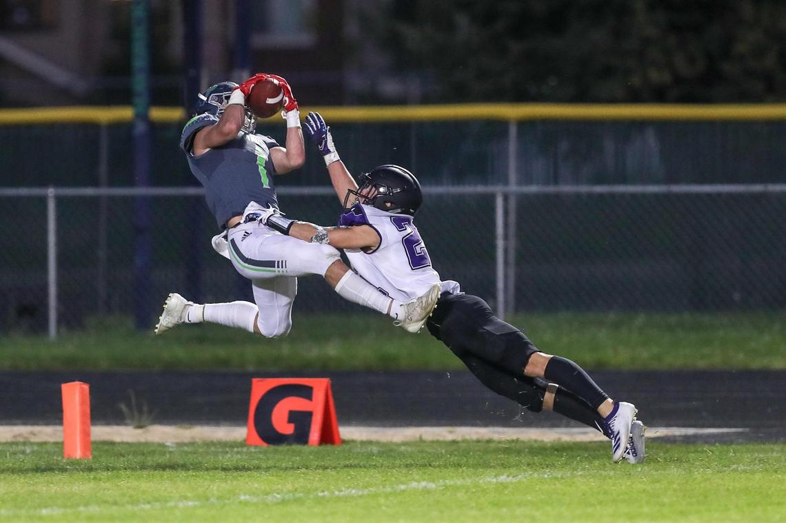 Mountain View wide receiver Kayden Chan catches a long pass down the sidelines over Rocky Mountain defensive back Beaux Taylor Friday, Sept. 4, 2020 at Mountain View High School in Meridian.
