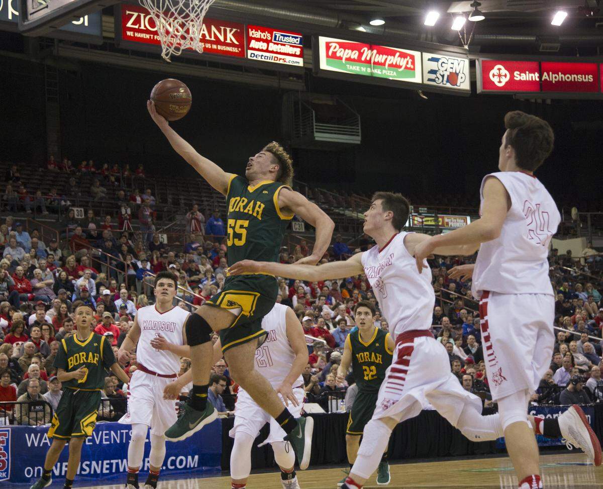 Borah’s Ellis Magnuson slices through Madison’s defense for a score in the first round of last year’s 5A state tournament.