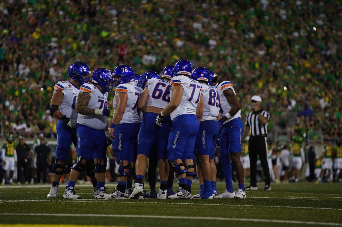 Boise State huddles up before a play at Oregon in September 2024. That game was a big payday for the university, and nearly a big win, with the Broncos falling 37-34 on a last-second field goal.