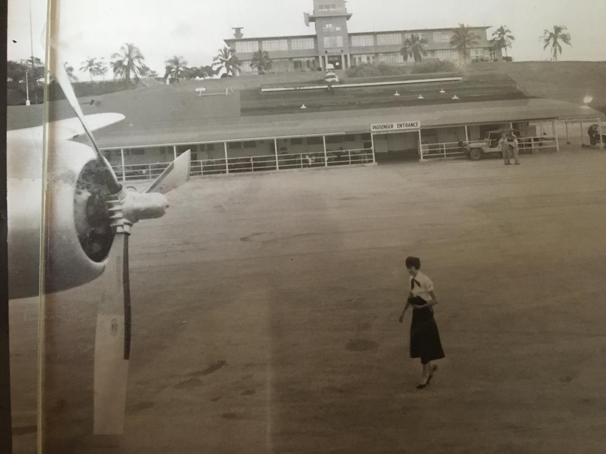 Wanda Pollard walks across the tarmac in front of the air terminal at Guantanamo Bay, Cuba, on Oct. 20, 1955.
