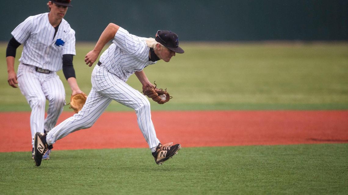 Timberline third baseman Garrett Miller fields a ground ball on the run and makes the throw to first against Mountain View in the semifinals of the 5A state baseball tournament Friday at Wolfe Field in Caldwell.