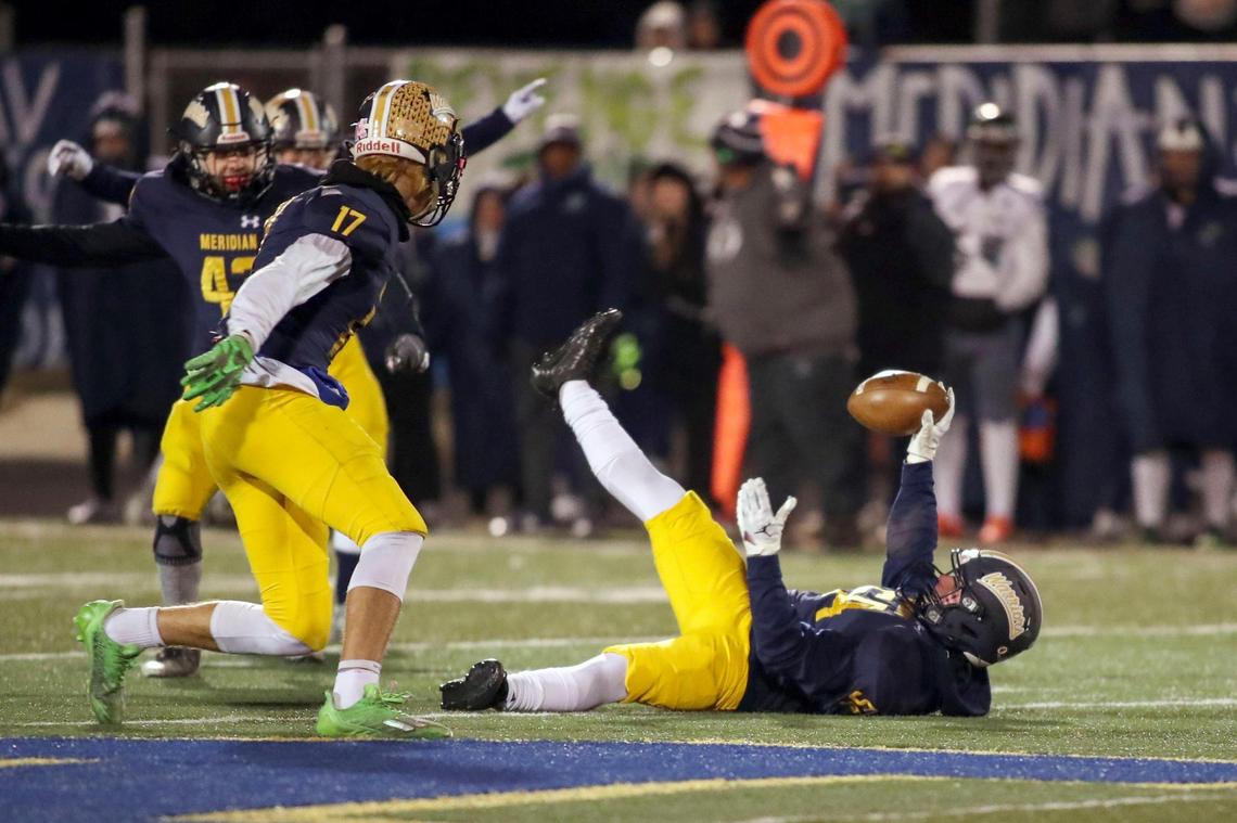 Meridian linebacker Jackson Gallian intercepts a Mountain View pass in the fourth quarter Friday.