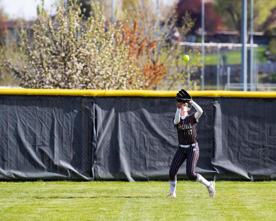 Vallivue senior Keelie Hancock makes a catch in the outfield during their game at Bishop Kelly on Tuesday.