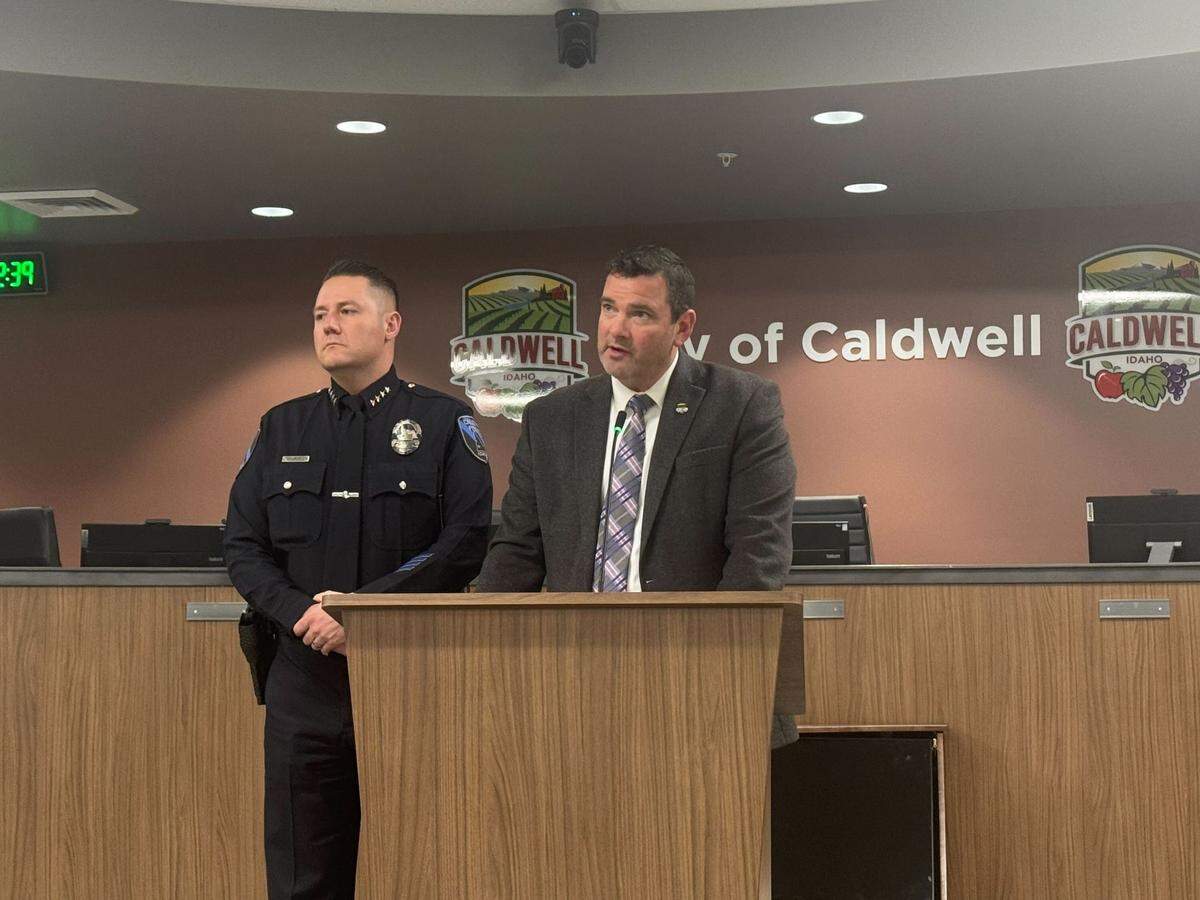 Caldwell Mayor Jarom Wagoner reads a statement regarding Police Chief Rex Ingram, left, during a short press briefing Friday. Wagoner took no questions about allegations leveled against Ingram and simply walked away after reading the statement.