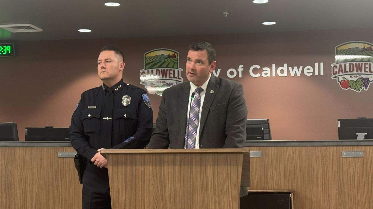Caldwell Mayor Jarom Wagoner reads a statement regarding Police Chief Rex Ingram, left, during a short press briefing Friday. Wagoner took no questions about allegations leveled against Ingram and simply walked away after reading the statement.
