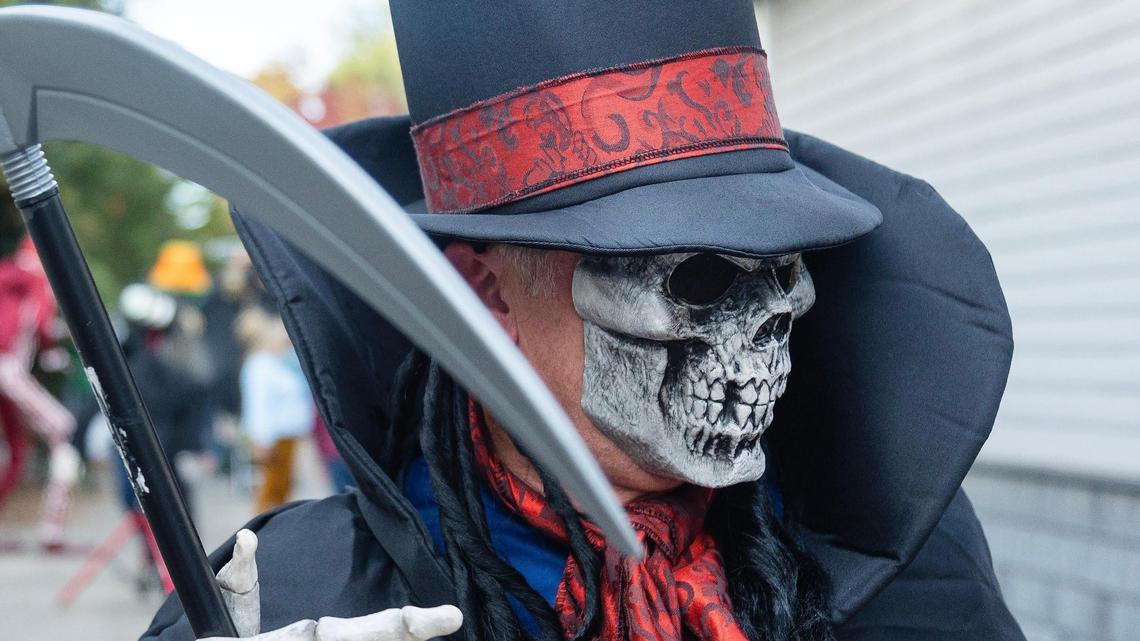 Douglas Smith stands in costume at the entrance to Spook Alle, an alleyway behind homes on Harrison Boulevard in Boise during Halloween on Oct 31, 2022.