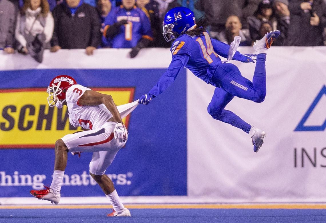 Boise State cornerback Tyler Horton makes a shirt tackle of Fresno State wide receiver KeeSean Johnson during the first half last week at Albertsons Stadium.
