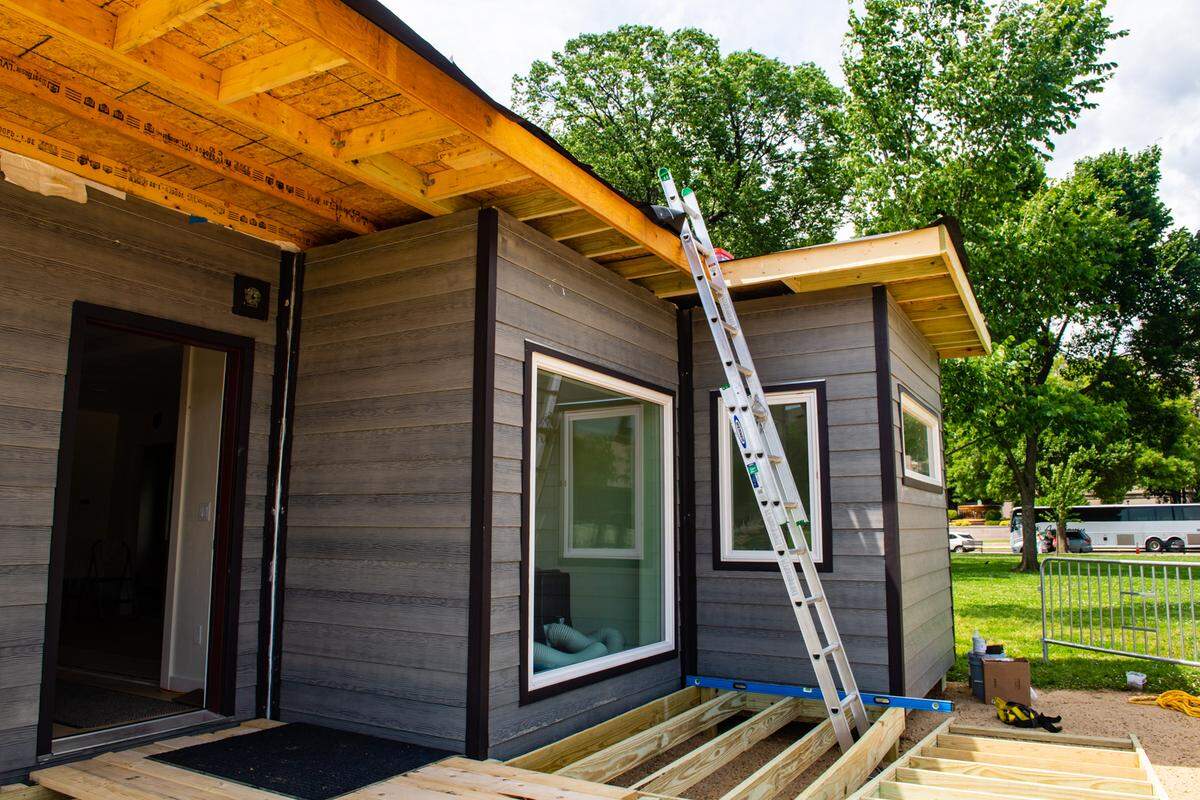 An unfinished home IndieDwell made from three shipping containers.
