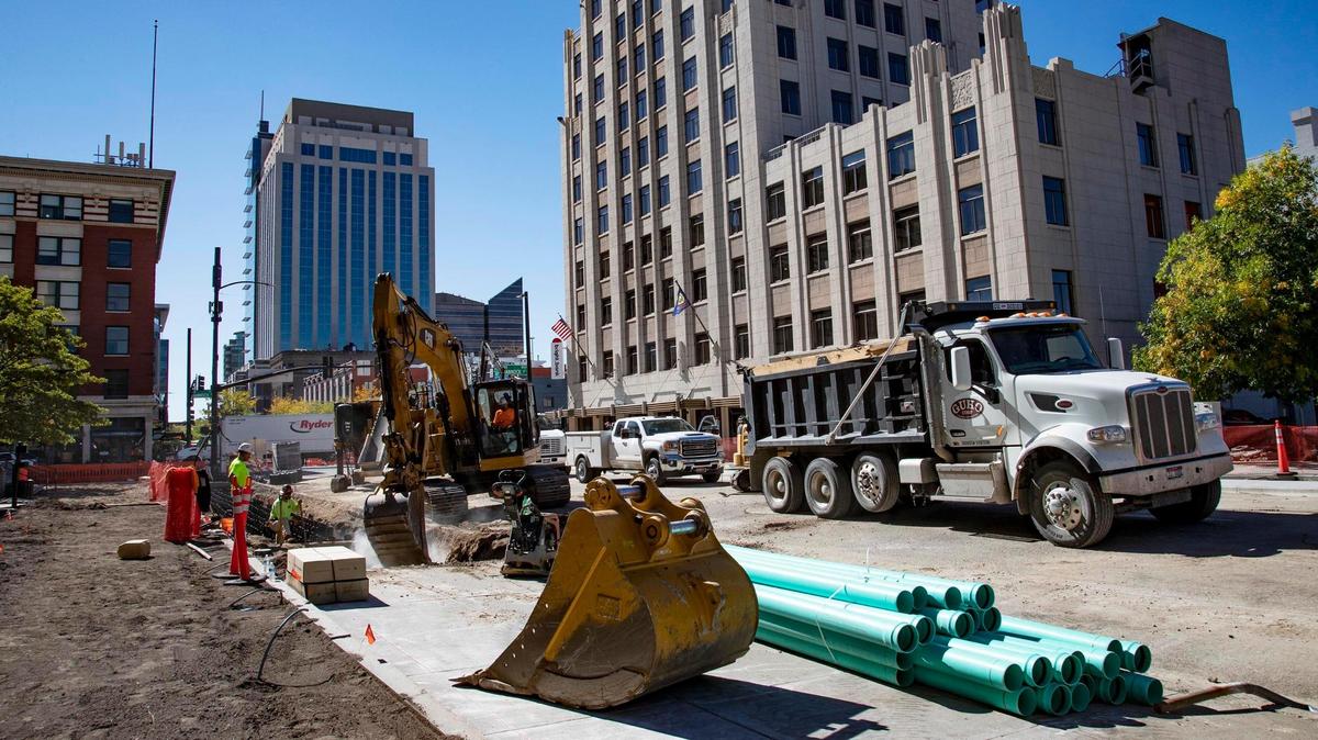 Crews work on a road project that will add a southbound bike lane to 8th Street between Bannock and Washington streets in downtown Boise. 