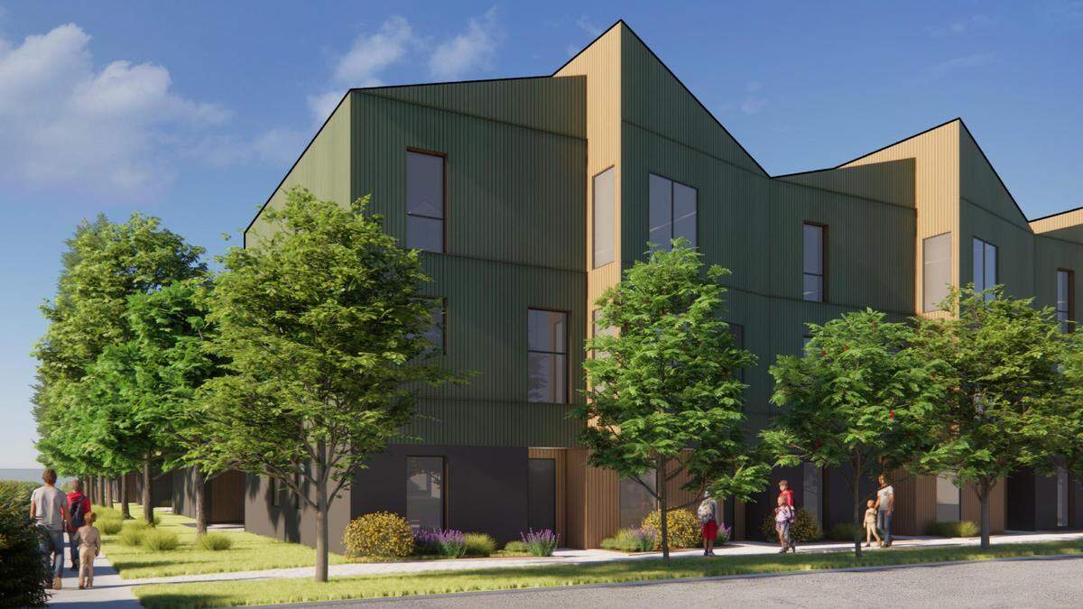 This preliminary rendering shows one of the three-story town house buildings.