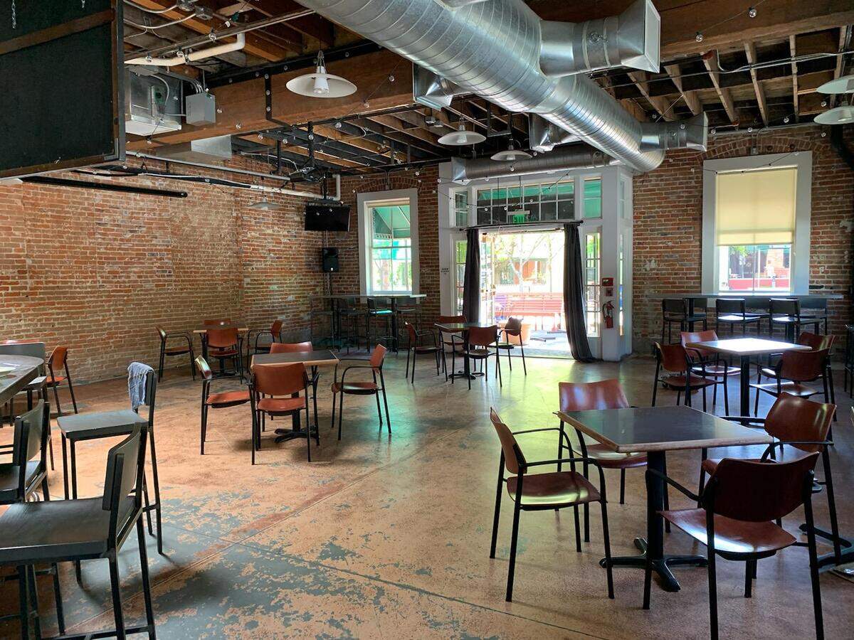 Socially distanced tables and chairs have been staged at Beside Bardenay, the event venue next door to Bardenay in downtown Boise. The room will be used for Bardenay overflow seating, if needed, owner Kevin Settles said. “We won’t seat the bar,” he added. “We can’t seat the bar. Because it’s a bar.”