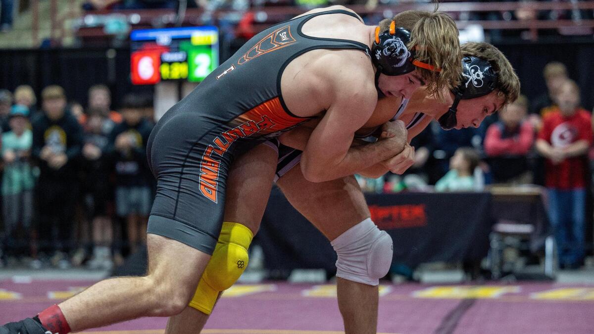 Fruitland’s Kaden MacKenzie, left, competes with Wasatch’s Henry Hanssen in the 152-pound championship at the Rollie Lane Invitational last winter.