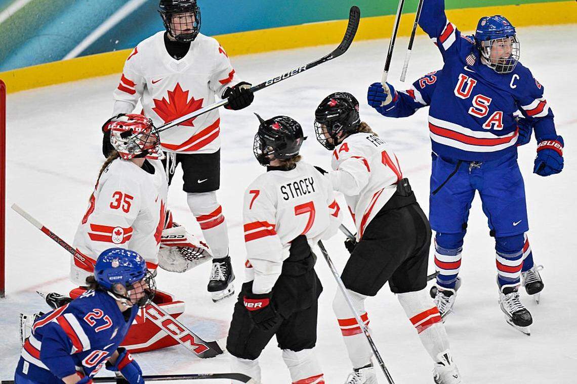 Team USA’s Hilary Knight, right, celebrates scoring her team's first goal against Canada's Ann-Renee Desbiens uring the women's gold medal ice hockey match between USA and Canada at the Milano Santagiulia Ice Hockey Arena during the Milano Cortina 2026 Winter Olympic Games in Milan, on Feb. 19, 2026. 