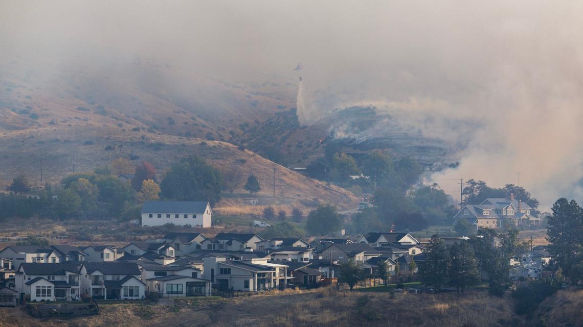 The Valley Fire burns in Boise near subdivisions along Warm Springs Avenue in the Boise Foothills on Friday.