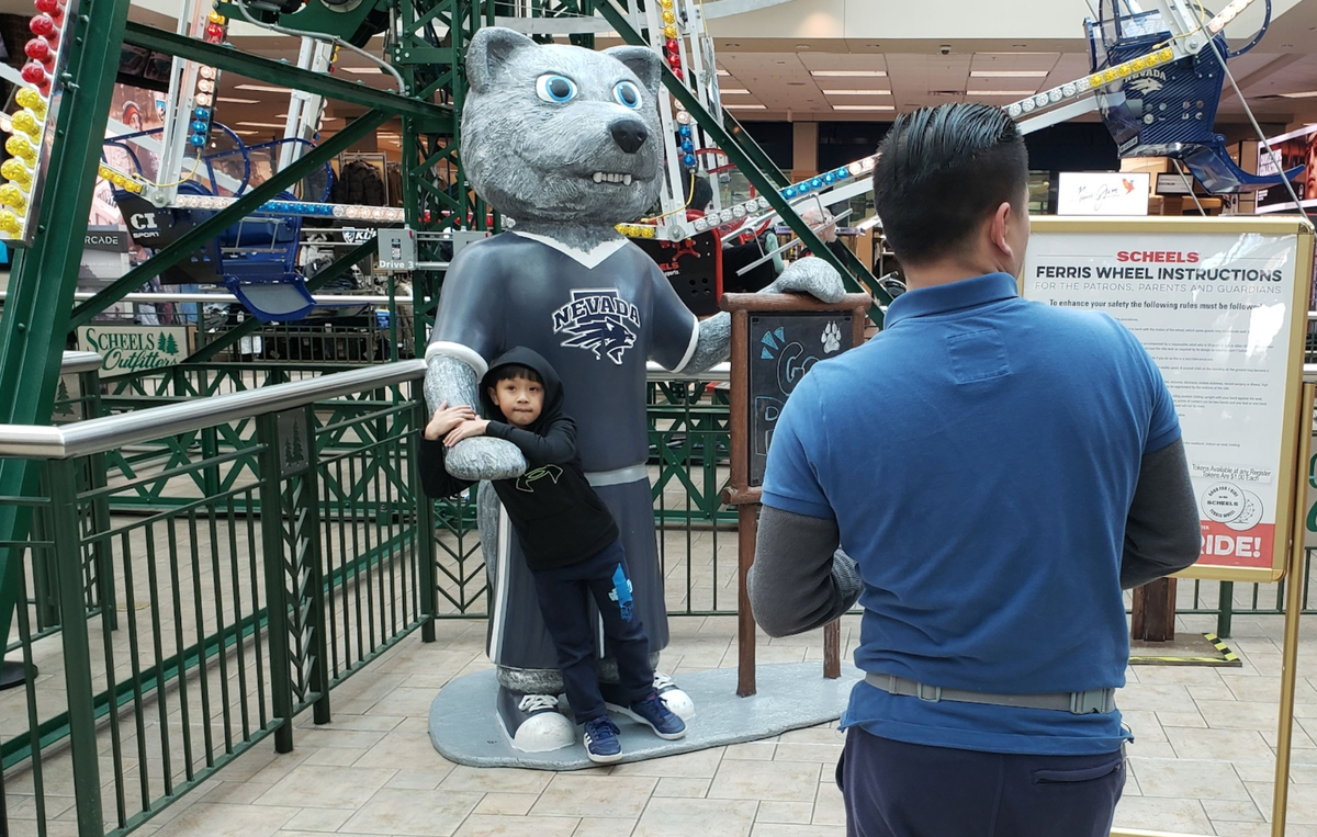 The Scheels store in Sparks, Nevada, includes a wolf dressed in a shirt for the University of Nevada, Reno. It’s a favorite for families to pose for photographs.