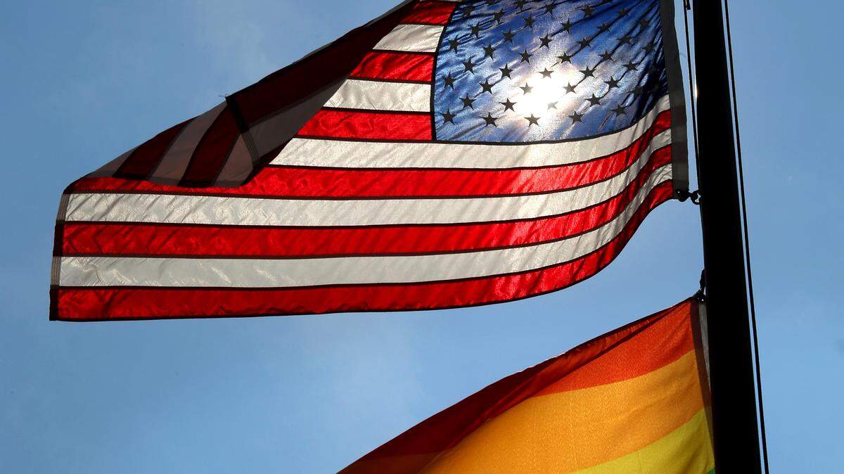 The American and gay pride flags fly at half-mast over the GLBT Community Center of Central Florida in 2016 in Orlando.