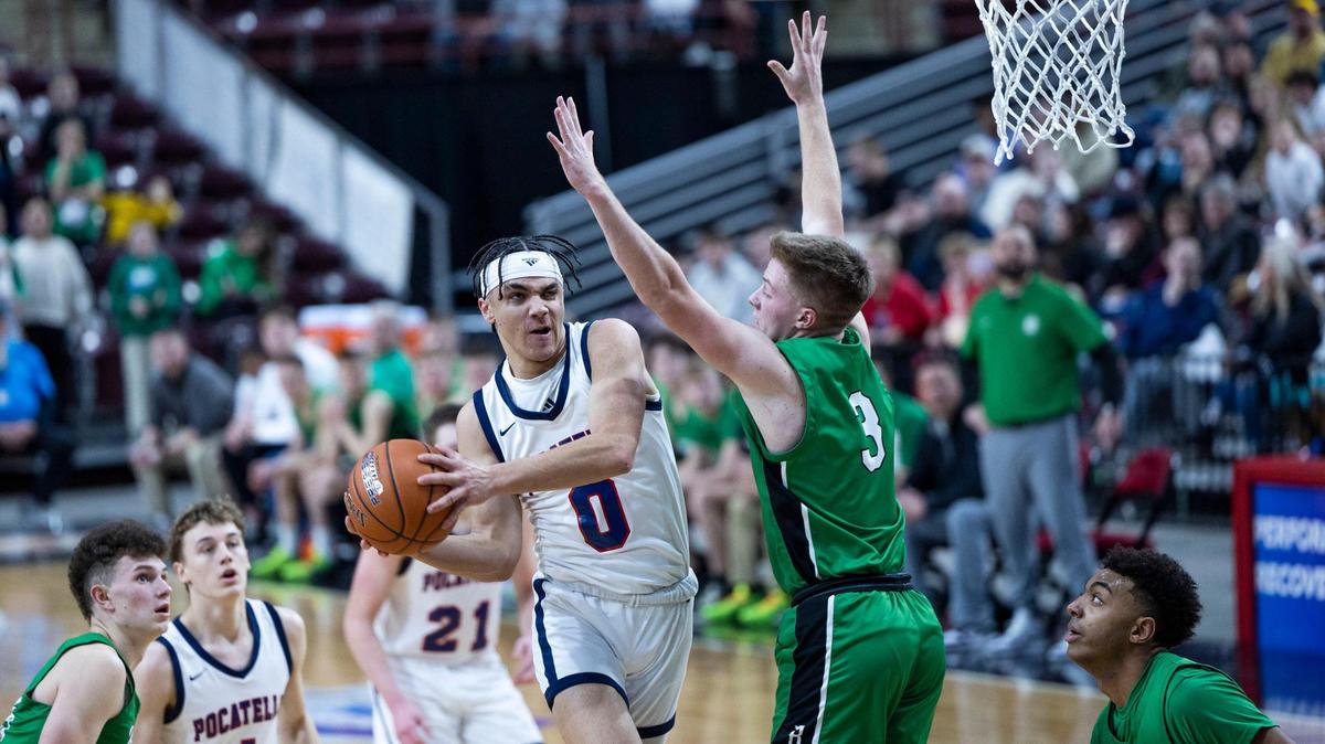 Pocatello junior Julian Bowie drives to the hoop defended by Blackfoot’s Jaxon Grimmett in the semifinals of the 4A boys boys basketball state tournament Friday at the Ford Idaho Center in Nampa.